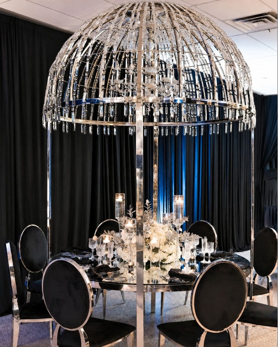 Mirrored dome centerpiece over a black and silver formal table
